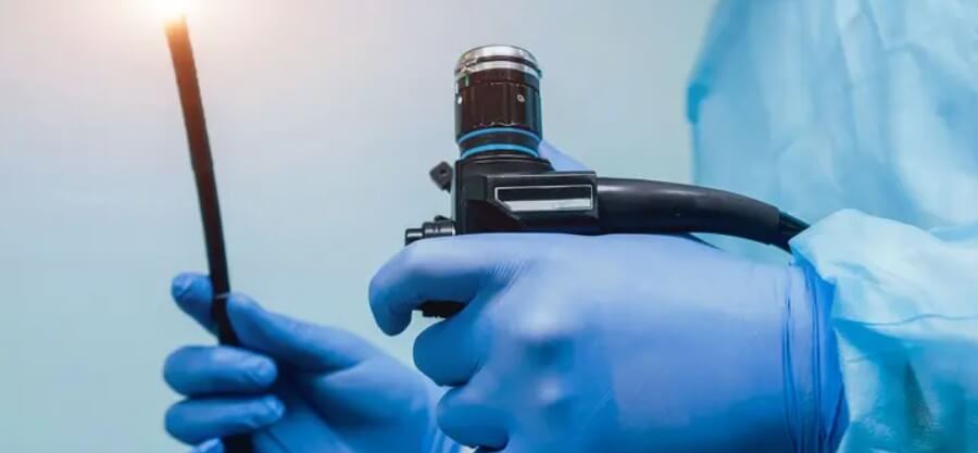Surgeon using endoscopy instruments in hospital